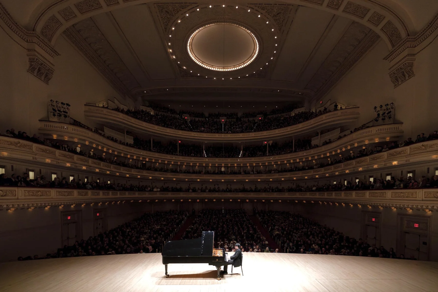 Bruce Liu on stage at the piano